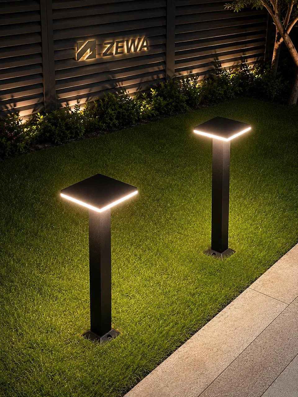 Bollard on a lawn at night