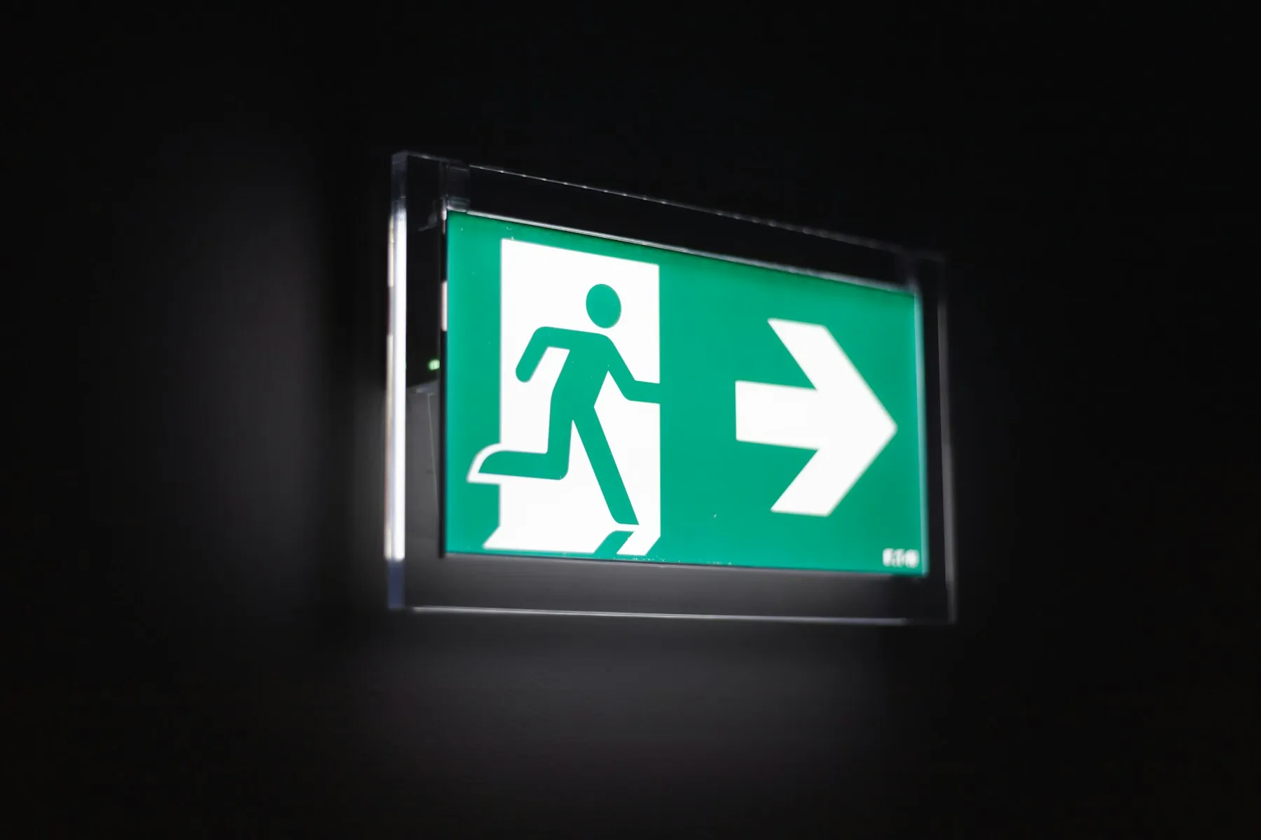 Illuminated emergency exit sign