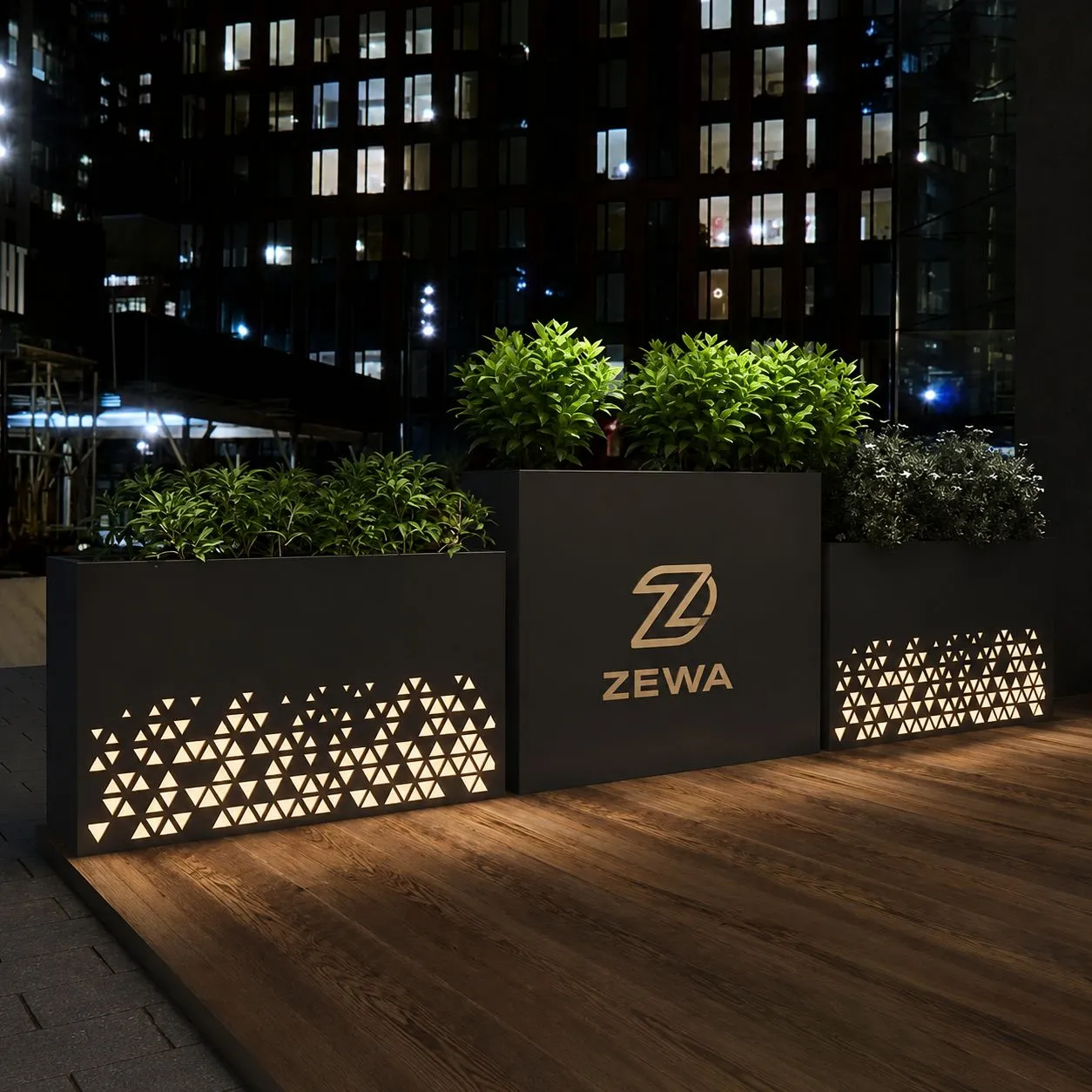 Laser-cut steel planters glowing at night